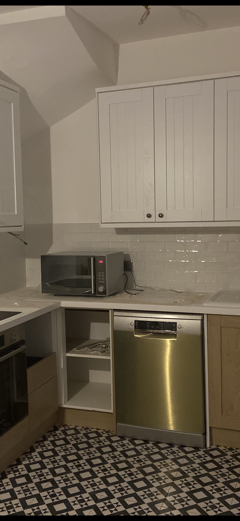 Kitchen renovation with cabinets and tiling
